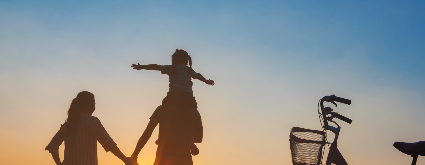 a family walking at sunset